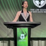 Black podium lectern with digital screen on stage