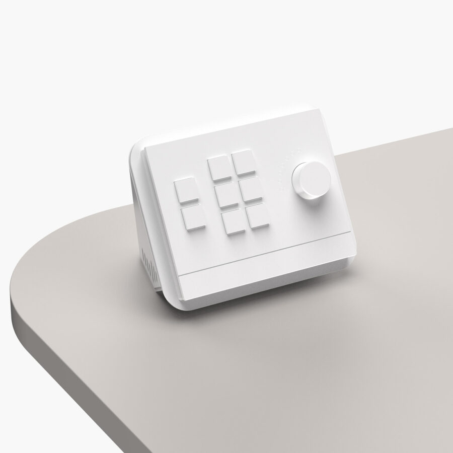 White desk-mounted housing for AMX Massio 8-Button Control Pad installed onto multimedia lectern worktop
