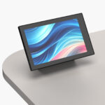 Desk-mount housing for Creston TSW-1060 Control Pad installed on lectern worktop