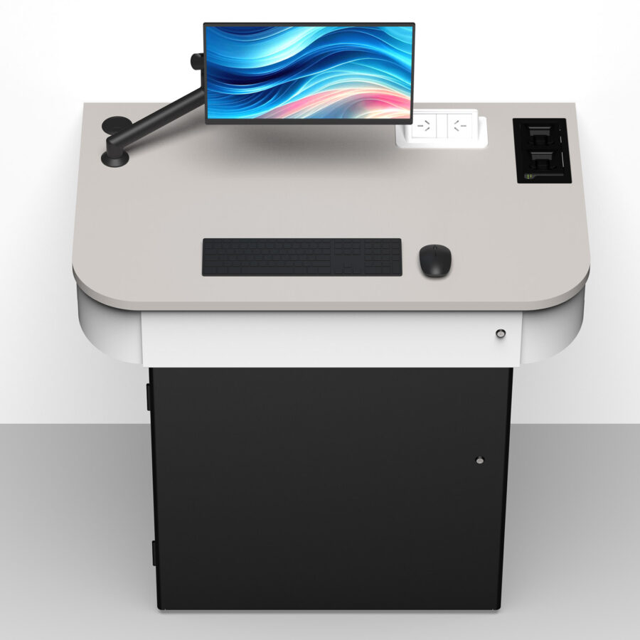 Wall positioned multimedia lectern with worktop-mounted monitor arm, power modules, battery charger housing and configurable internal AV storage.