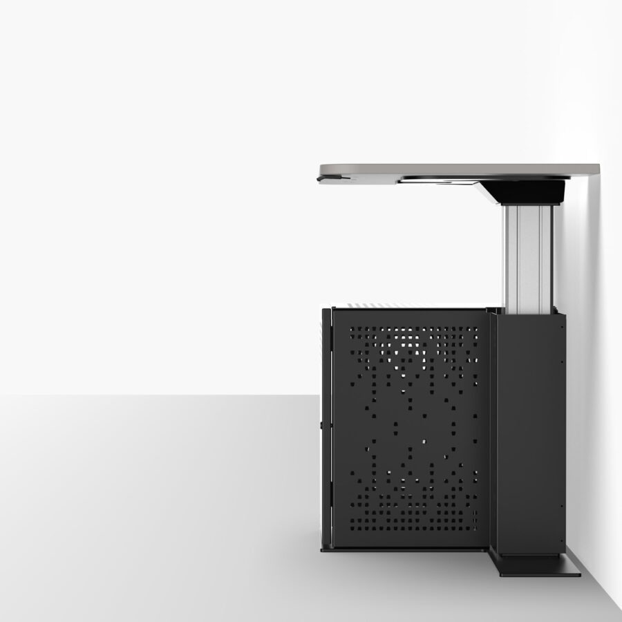 Height adjustable multimedia teachers desk shown positioned up against a wall